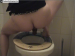 A European girl with a lot of pubic hair takes a dump while squatting over a toilet. Over 3 minutes.